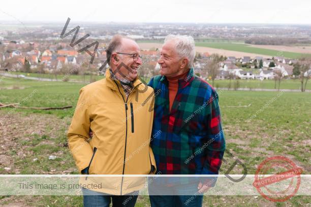 senior gay couple portrait, rural background